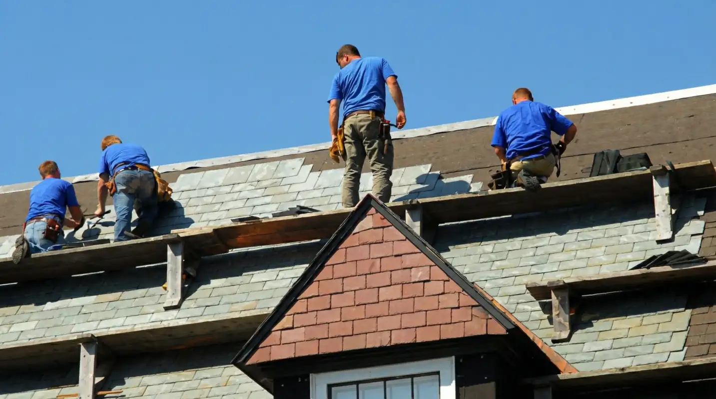 Roof replacement in progress with a team of professional contractors installing new shingles on a residential home in Clearwater, FL